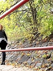 15 pictures - Nervous girl pisses outside on stones