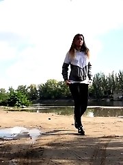 15 pictures - Brunette girl keeps a lookout while pissing