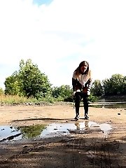 15 pictures - Brunette girl keeps a lookout while pissing