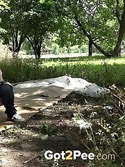 15 pictures - Redhead babe squatting to pee over cardboard