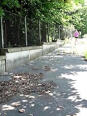 15 pictures - Sexy dark haired babe pisses outside