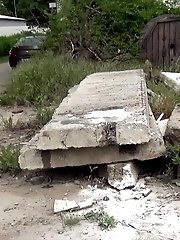 15 pictures - Hot blonde pisses onto a concrete slab
