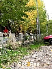 15 pictures - Black haired babe shows her pussy and pees