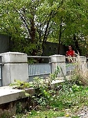 15 pictures - Black haired babe shows her pussy and pees