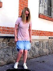 15 pictures - Gorgeous blonde is filmed peeing in public