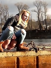 15 pictures - Pretty blonde squatting to pee by the river