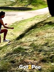 15 pictures - Gorgeous dark haired girl pisses near some stones