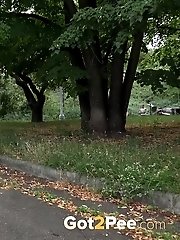 15 pictures - Sexy black haired babe standing to pee outside