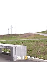 15 pictures - Chubby redhead leaves a puddle of piss behind