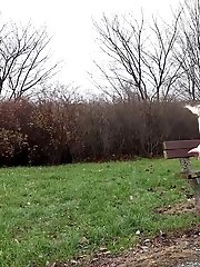 15 pictures - Sexy girl in wet look hotpants pisses in public