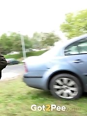 15 pictures - Exotic babe squats behind parked car to piss