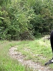 15 pictures - Nervous European girl pisses on grass outside