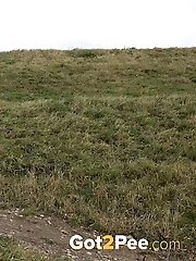 15 pictures - Dark haired babe pisses in the countryside