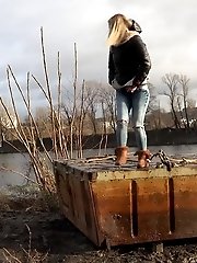15 pictures - Pretty blonde squatting to pee by the river