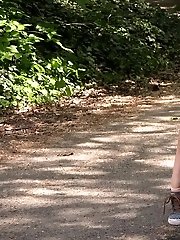 15 pictures - Gorgeous European makes a pissy mess on a path