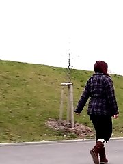 15 pictures - Chubby redhead leaves a puddle of piss behind