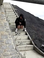 15 pictures - Pretty dark haired girl in glasses pees outside