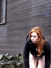 15 pictures - Redhead babe pisses outside on the ground