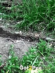 15 pictures - Beautiful dark haired teen pees on the soil