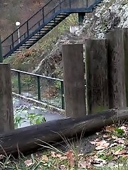 15 pictures - European girl in red tee pisses on fallen leaves