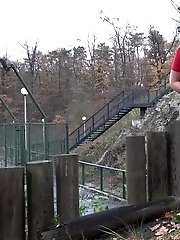 15 pictures - European girl in red tee pisses on fallen leaves