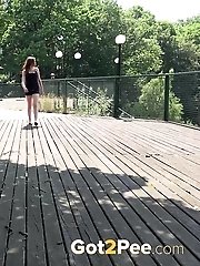 15 pictures - European babe pisses all over wooden decking