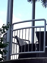 15 pictures - Pretty redhead pisses over her balcony