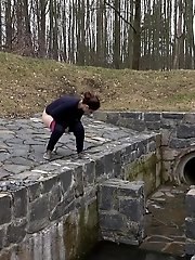15 pictures - Antonia pees outside next to drainage pipe