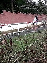 15 pictures - Stunning dark haired babe sprays pee on the ground