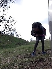 15 pictures - Shy teen pisses behind a parked car on the grass