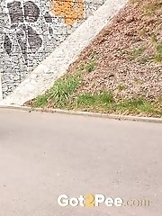 15 pictures - Short haired babe sprays her piss over the ground