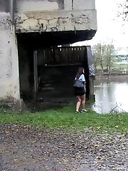 15 pictures - Hot brunette pisses into a flowing river