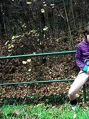 15 pictures - Brunette pisses while standing up next to a road