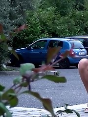 15 pictures - Redhead babe leans against a post to pee