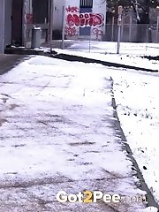 15 pictures - Pretty girl in scarf sprays her golden piss