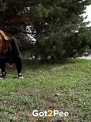 15 pictures - Pretty babe in glasses pisses outside