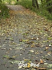 15 pictures - Pretty dark haired girl pisses while on a jog