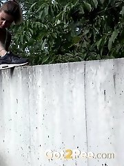 15 pictures - Pretty babe lifts her leg up to piss outside