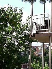 15 pictures - Pretty redhead pisses over her balcony