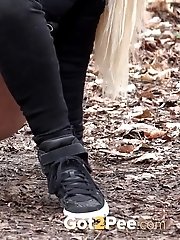 15 pictures - Blonde babe squatting to pee outside in the woods