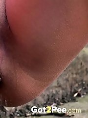 15 pictures - Gorgeous blonde sprays her piss outside