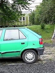 15 pictures - Blonde babe pisses next to a parked car