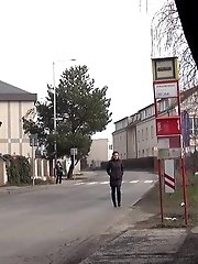 15 pictures - Sexy brunette babe pisses behind a bus stop