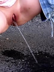 15 pictures - Gorgeous blonde is filmed peeing in public