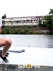 15 pictures - Sweet girl needs to piss as she waits for a bus