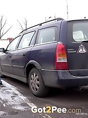 15 pictures - Violette pisses in between two parked cars