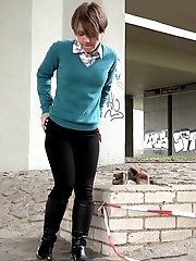 15 pictures - Cute girl in boots pisses outside in the city