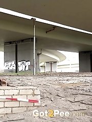 15 pictures - Cute girl in boots pisses outside in the city