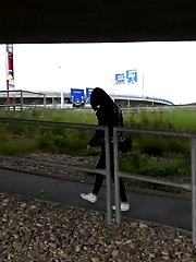 15 pictures - Pretty dark haired girl in glasses pees outside