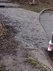 15 pictures - Blonde babe Claudia pisses down a drain outside